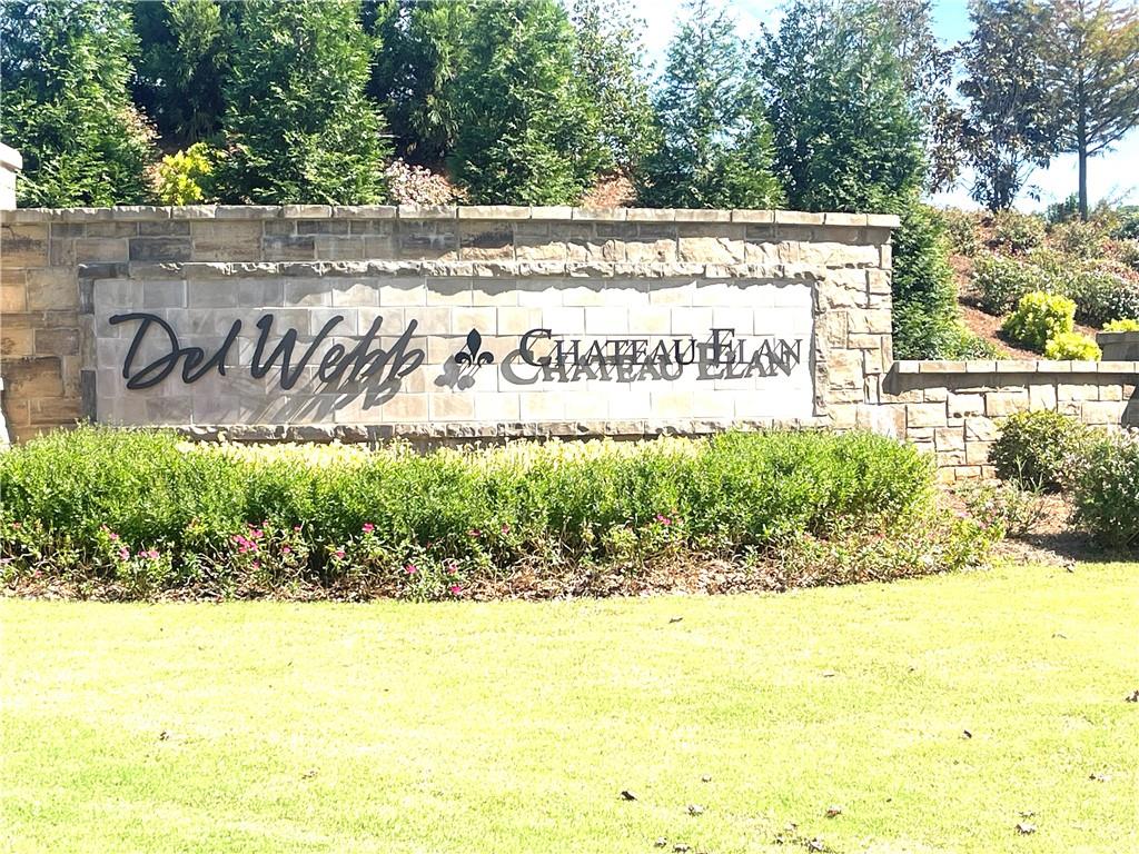 5709 Grapewood Street Hoschton, GA 30548 - Photo 60 of 65 a sign that is on the side of a street