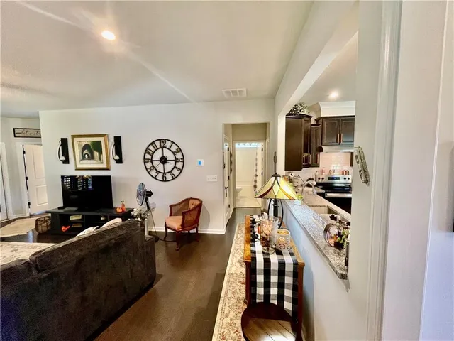 a view of a kitchen with workspace and a window