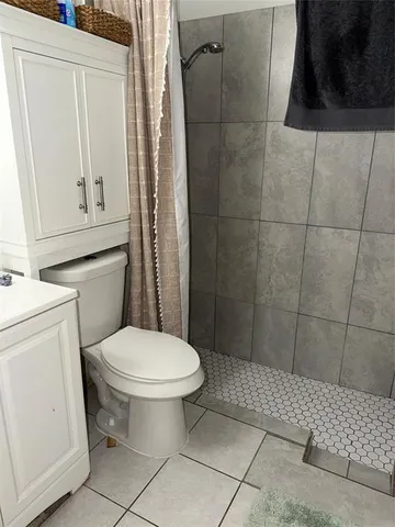 a view of a patio with furniture and a fire pit