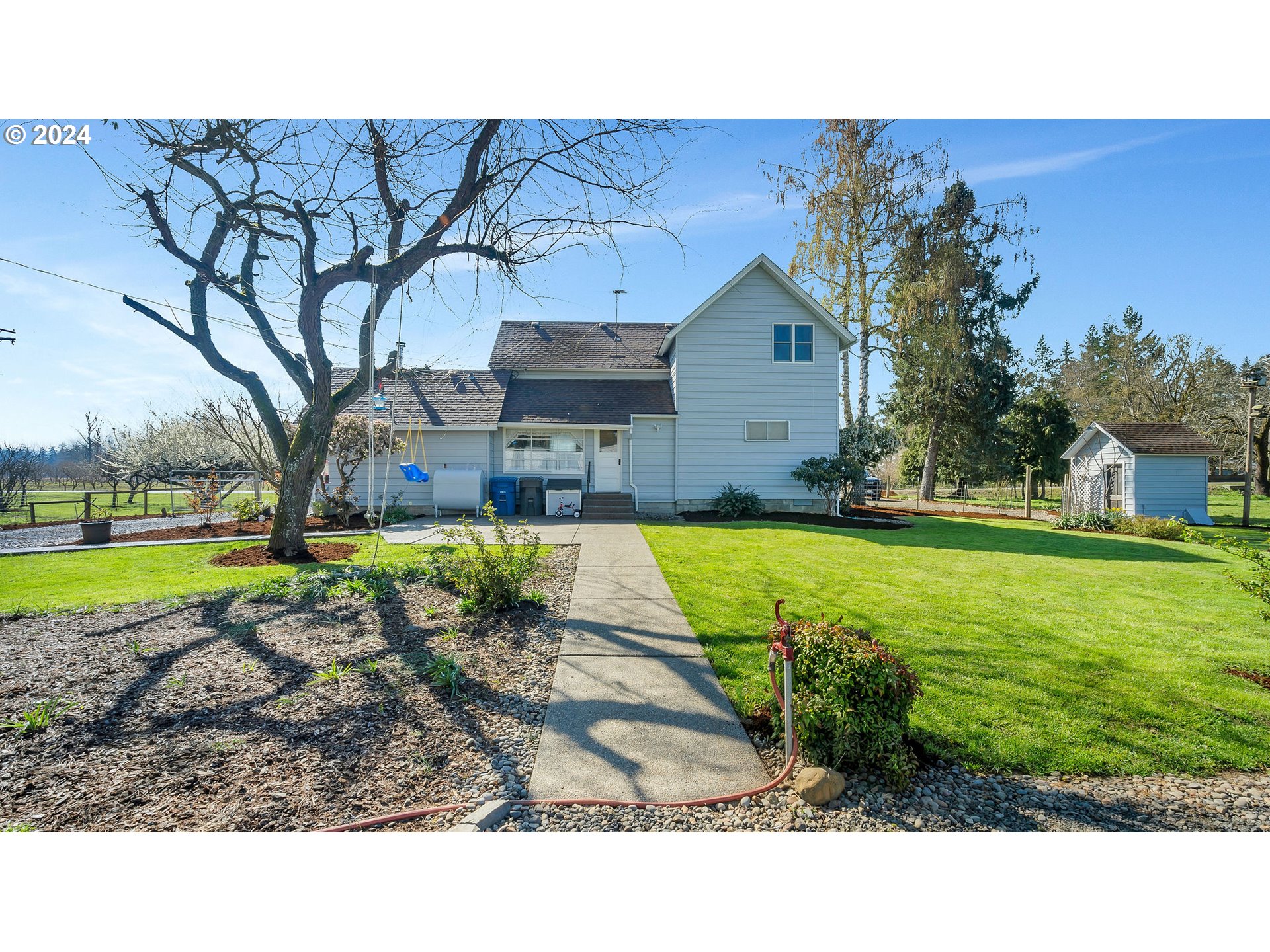 7305 South Drake Road Mount Angel, OR 97362 - Photo 10 of 33 a view of a house with a yard