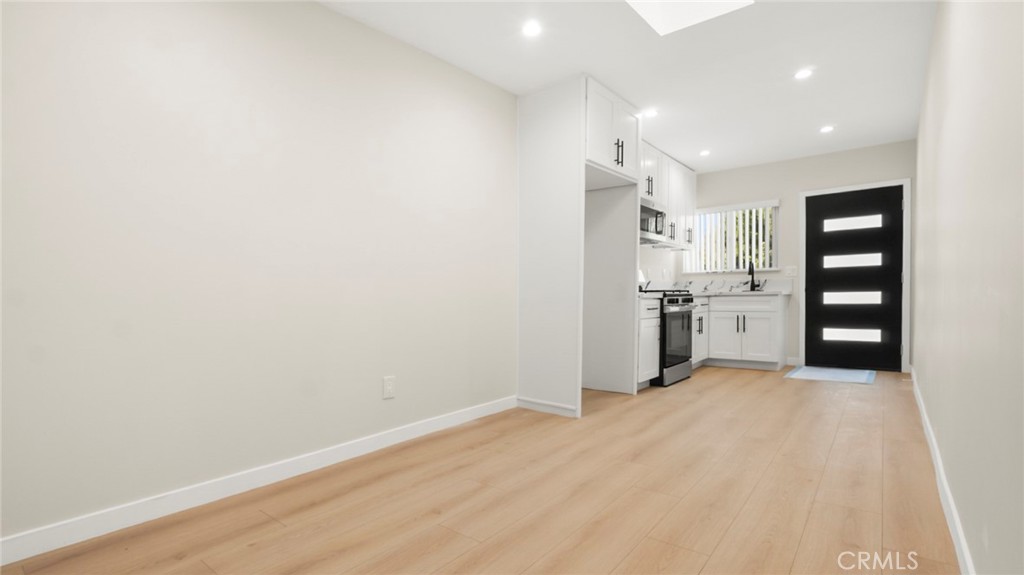 19928 Hatton Street Winnetka, CA 91306 - Photo 2 of 15 a view of a kitchen with wooden floor