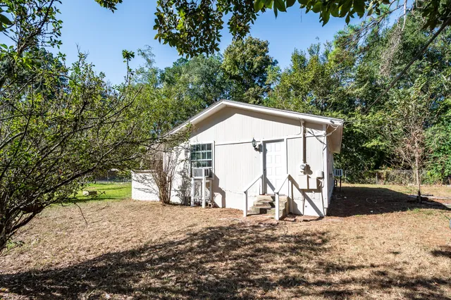 a house with trees in the background