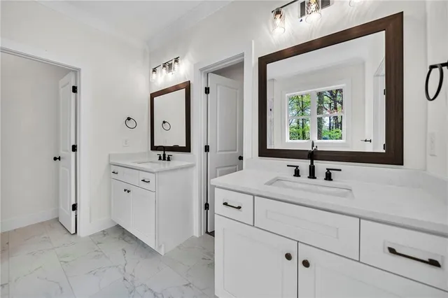 a bathroom with a sink and shower