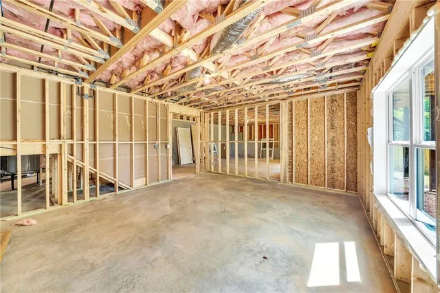 a view of an empty room with wooden walls