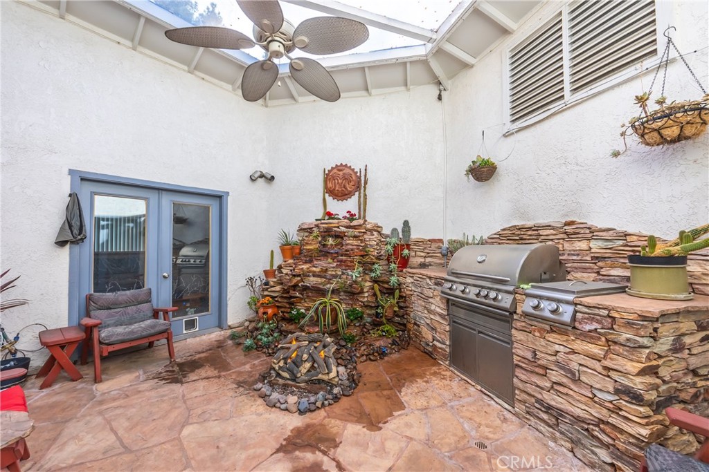 1036 Occidental Circle Redlands, CA 92374 - Photo 22 of 25 Atrium with Built in Fountain, Fire Pit and BBQ