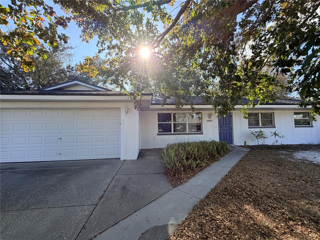 1365 Alton Road Port Charlotte, FL 33952 - Photo 1 of 13 front view of a house with a yard