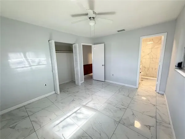 a view of an empty room with a window