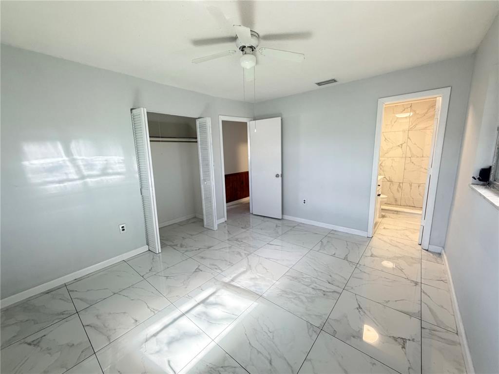 1365 Alton Road Port Charlotte, FL 33952 - Photo 12 of 13 a view of an empty room with a window