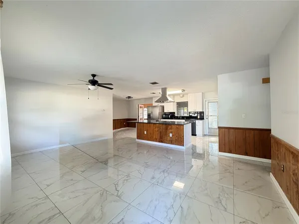 a view of kitchen with cabinets