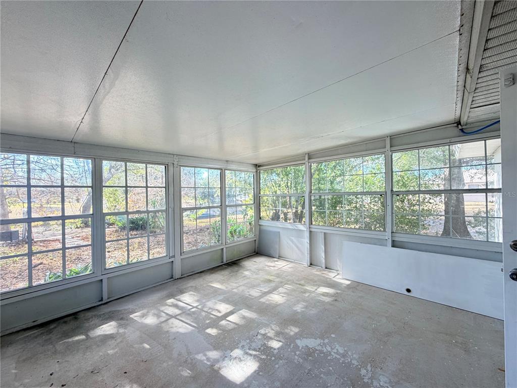 1365 Alton Road Port Charlotte, FL 33952 - Photo 9 of 13 a view of an empty room with a window