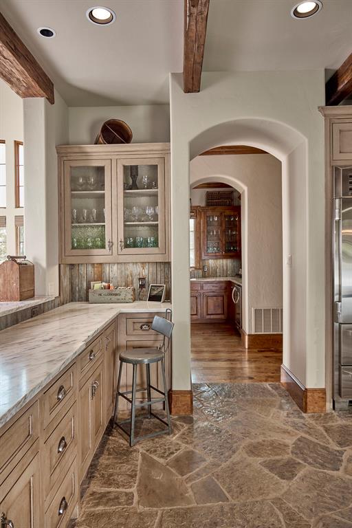 4951 Bridle Bit Road Flower Mound, TX 75022 - Photo 17 of 33 View towards bar with built ins and wine fridge