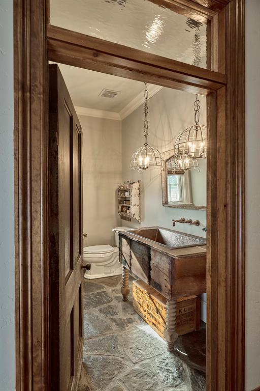 4951 Bridle Bit Road Flower Mound, TX 75022 - Photo 22 of 33 Designer touches extend to the powder bath for guests!
