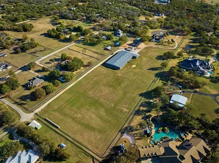 a view of swimming pool with outdoor seating and trees