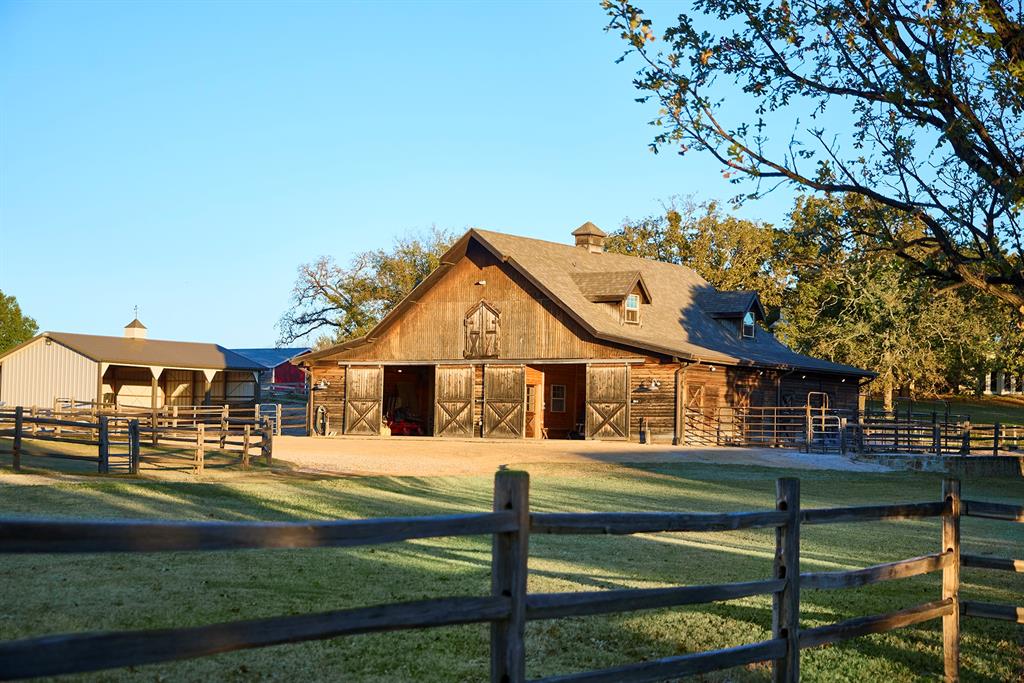 4951 Bridle Bit Road Flower Mound, TX 75022 - Photo 29 of 33 Six (6) 12x12 stalls, tack room, office and half bath.