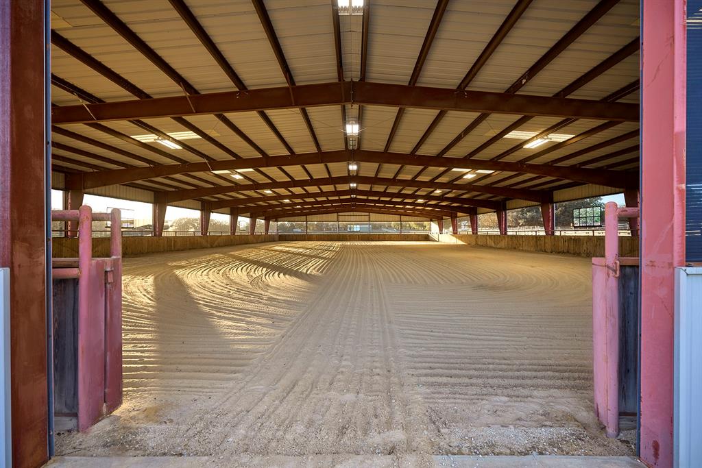 4951 Bridle Bit Road Flower Mound, TX 75022 - Photo 31 of 33 200x100 lighted, covered arena has retractable screens, sound and sprinkler systems.