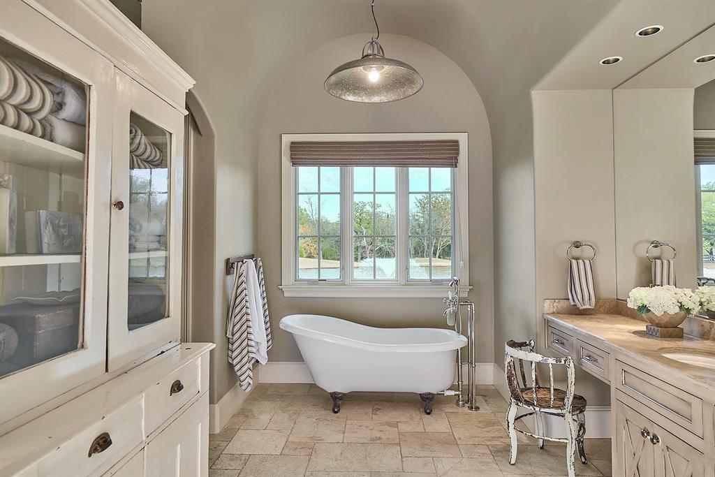 4951 Bridle Bit Road Flower Mound, TX 75022 - Photo 8 of 33 Casement window in soaking tub alcove overlooks pond.