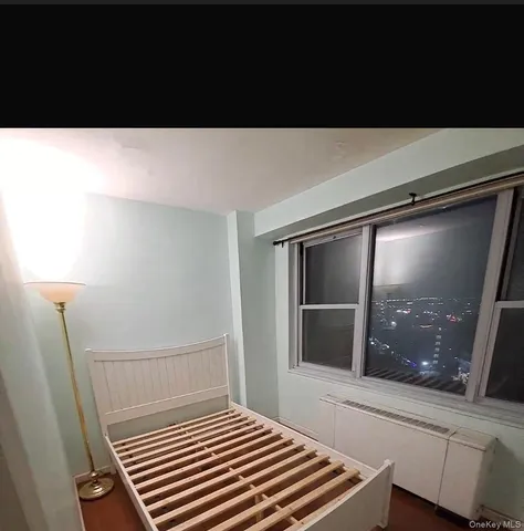 a living room with a bed furniture and a window