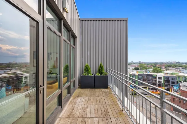 a view of balcony with a potted plant