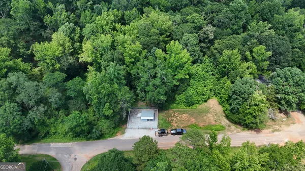 an aerial view of a house with yard