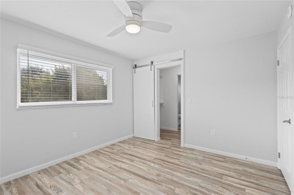 3801 42nd Street West Bradenton, FL 34205 - Photo 17 of 34 a view of empty room with wooden floor and fan