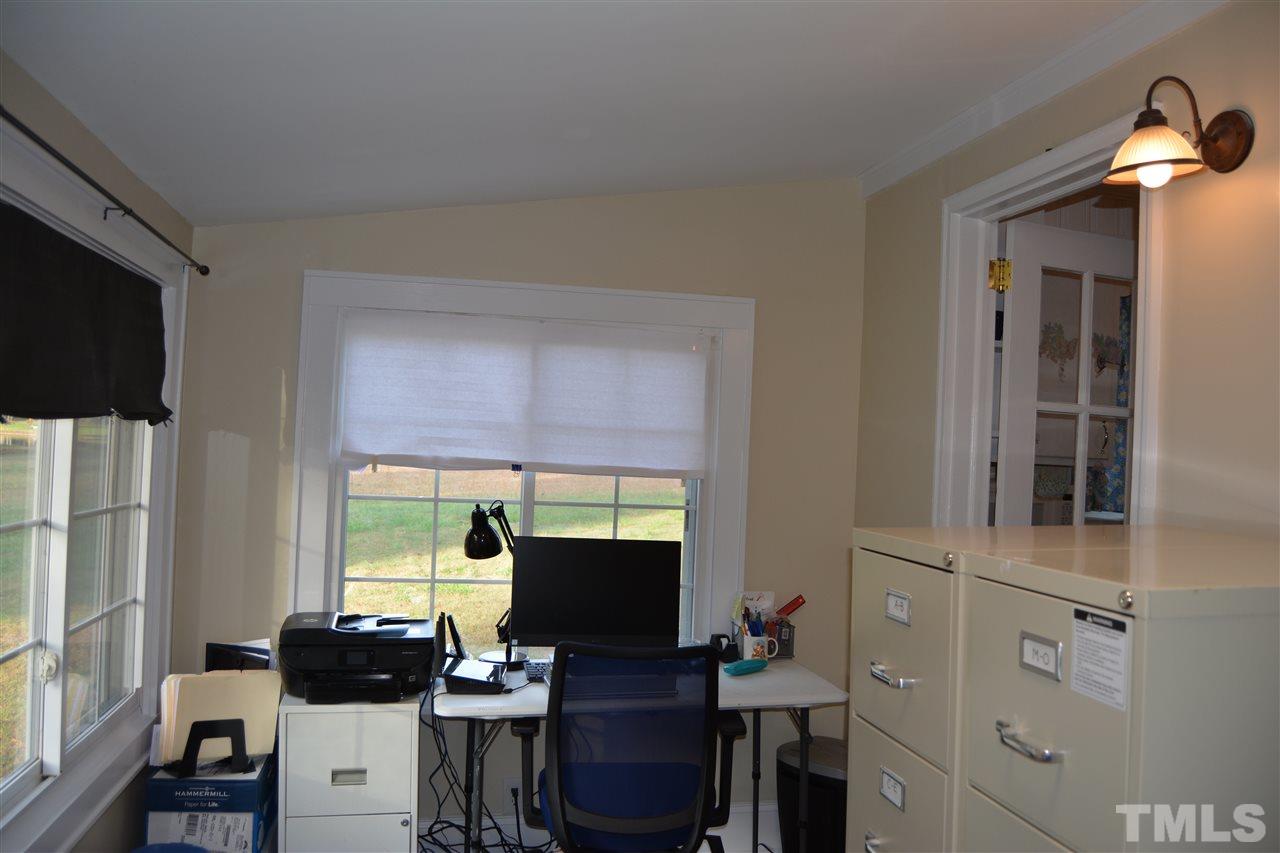 3056 Seven Paths Road Louisburg, NC 27549 - Photo 13 of 29 Off from the kitchen you will find the office/laundry room. Plenty of room for both. If you don't want to use this area as an office it would make a great sitting area.