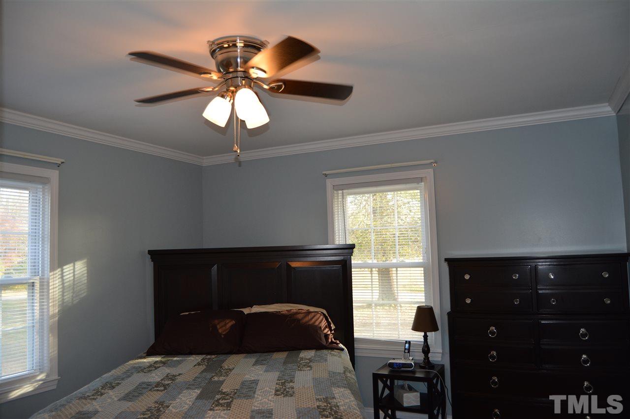 3056 Seven Paths Road Louisburg, NC 27549 - Photo 15 of 29 Master bedroom feature two closets & ceiling fan