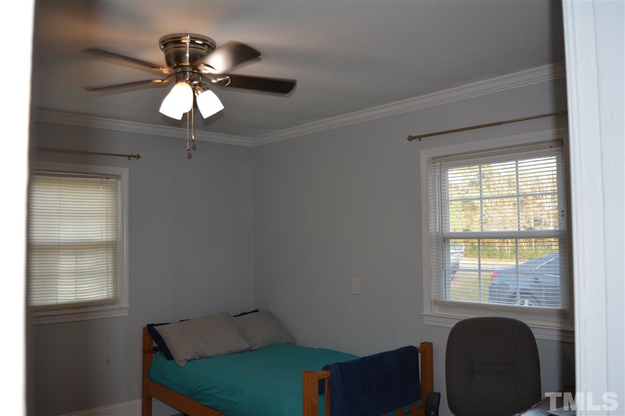 3056 Seven Paths Road Louisburg, NC 27549 - Photo 17 of 29 Bedroom 1 features ceiling fan, gel cushion padded carpeting and a large closet.