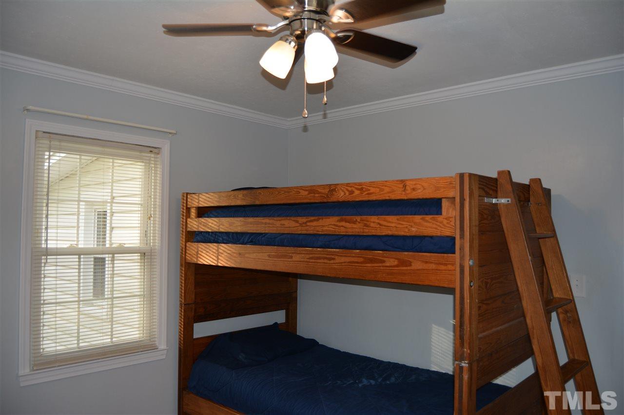 3056 Seven Paths Road Louisburg, NC 27549 - Photo 19 of 29 Bedroom 2 features ceiling fan and closet