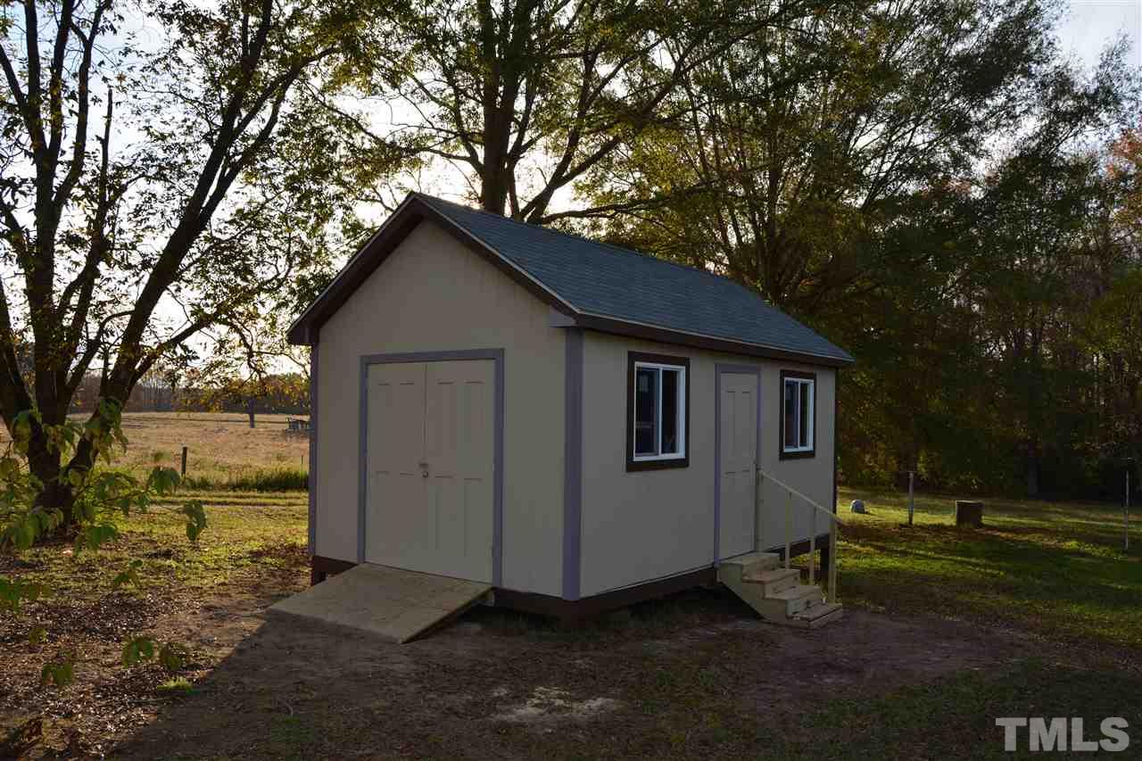3056 Seven Paths Road Louisburg, NC 27549 - Photo 27 of 29 This storage building also has a ramp for easy loading things inside.