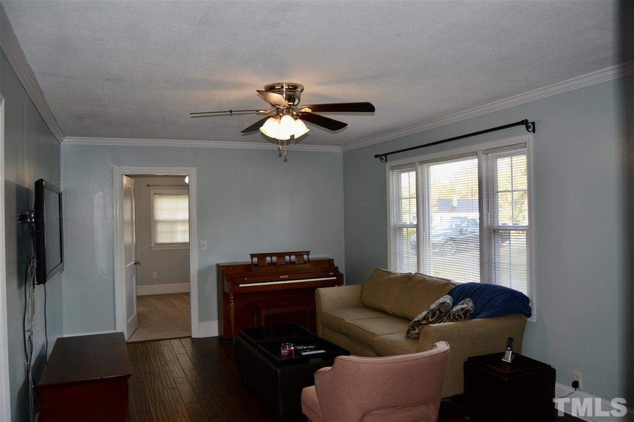 3056 Seven Paths Road Louisburg, NC 27549 - Photo 4 of 29 Welcome Home This freshly painted, new crown molding and shoe molding throughout. You will find ceiling fans in all rooms.
