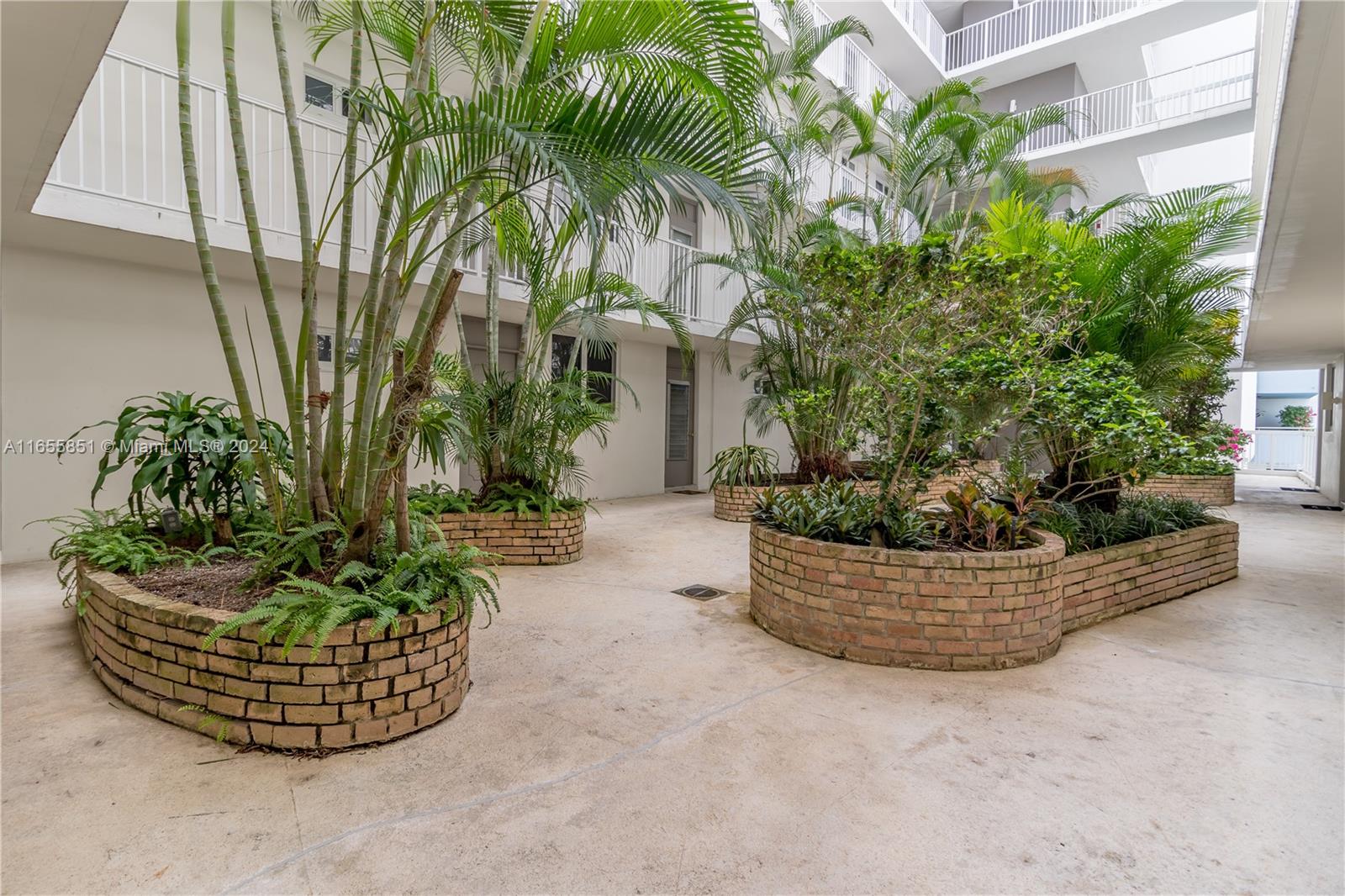 1670 Bay Road, Unit 2E Miami Beach, FL 33139 - Photo 11 of 27 Lovely center courtyard entrance