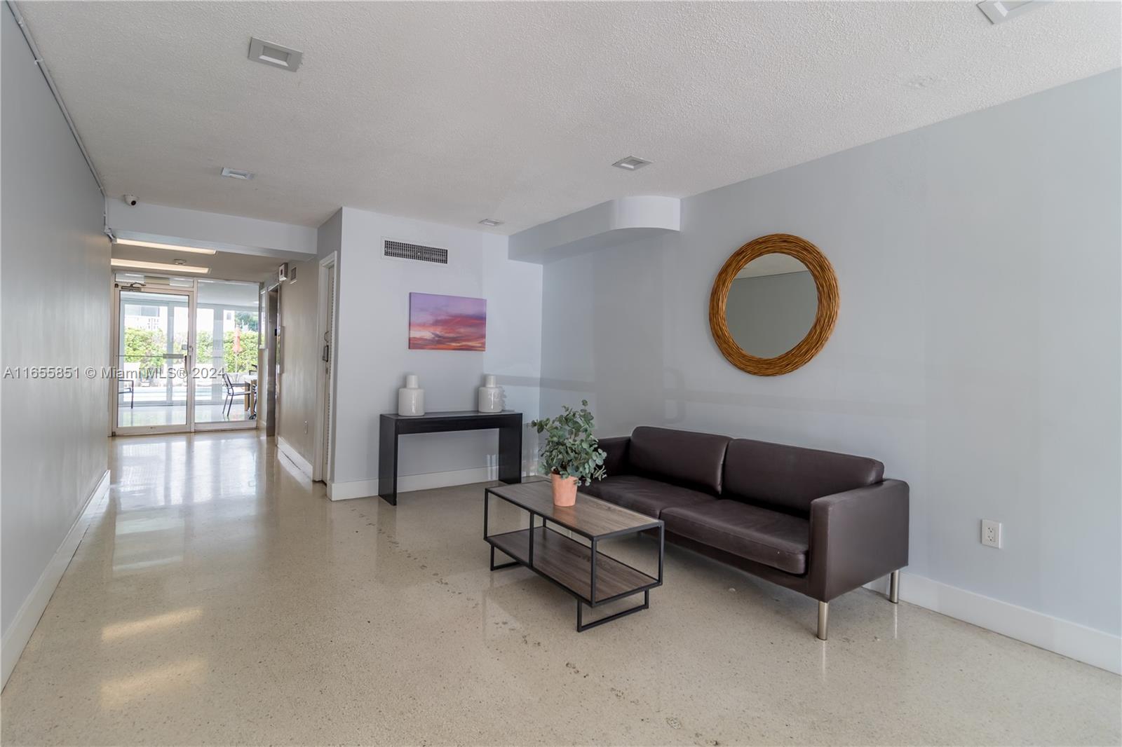 1670 Bay Road, Unit 2E Miami Beach, FL 33139 - Photo 23 of 27 Air Conditioned lobby and common room