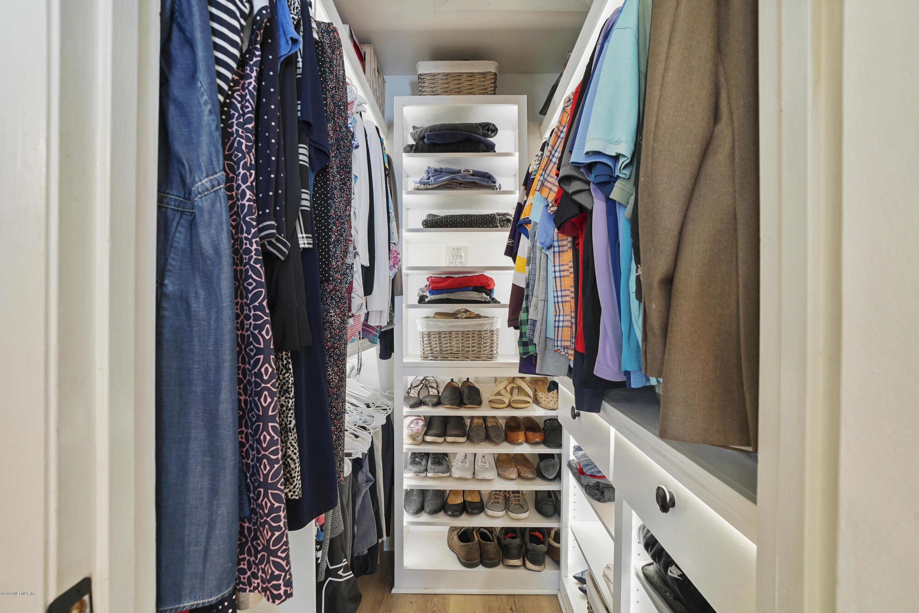 2465 Wattle Tree Road West Jacksonville, FL 32246 - Photo 23 of 31 a view of walk in closet with clothes and shoes