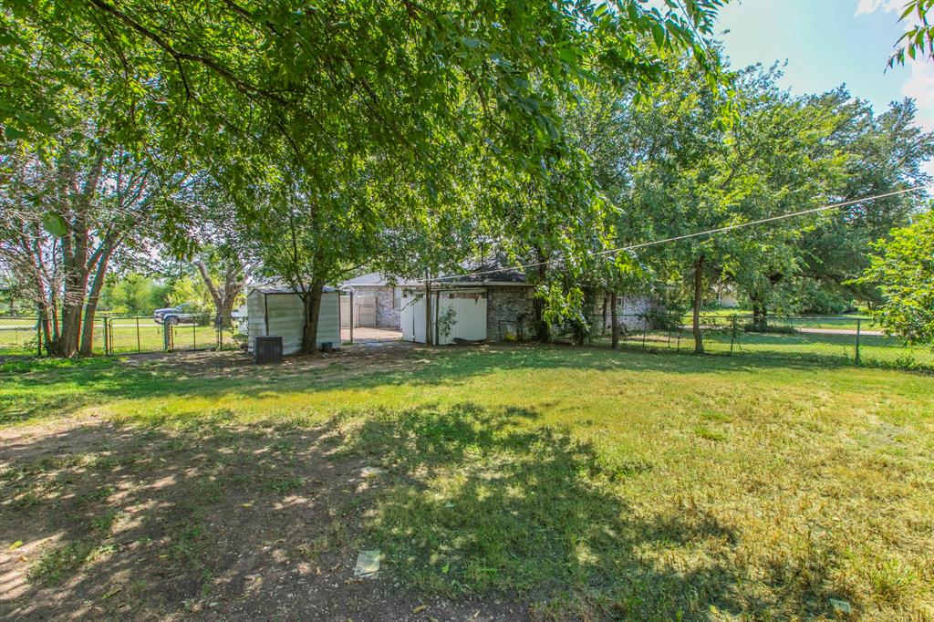 1936 Post Oak Drive Waco, TX 76705 - Photo 25 of 33 View of yard with view of scattered trees and an outdoor structure