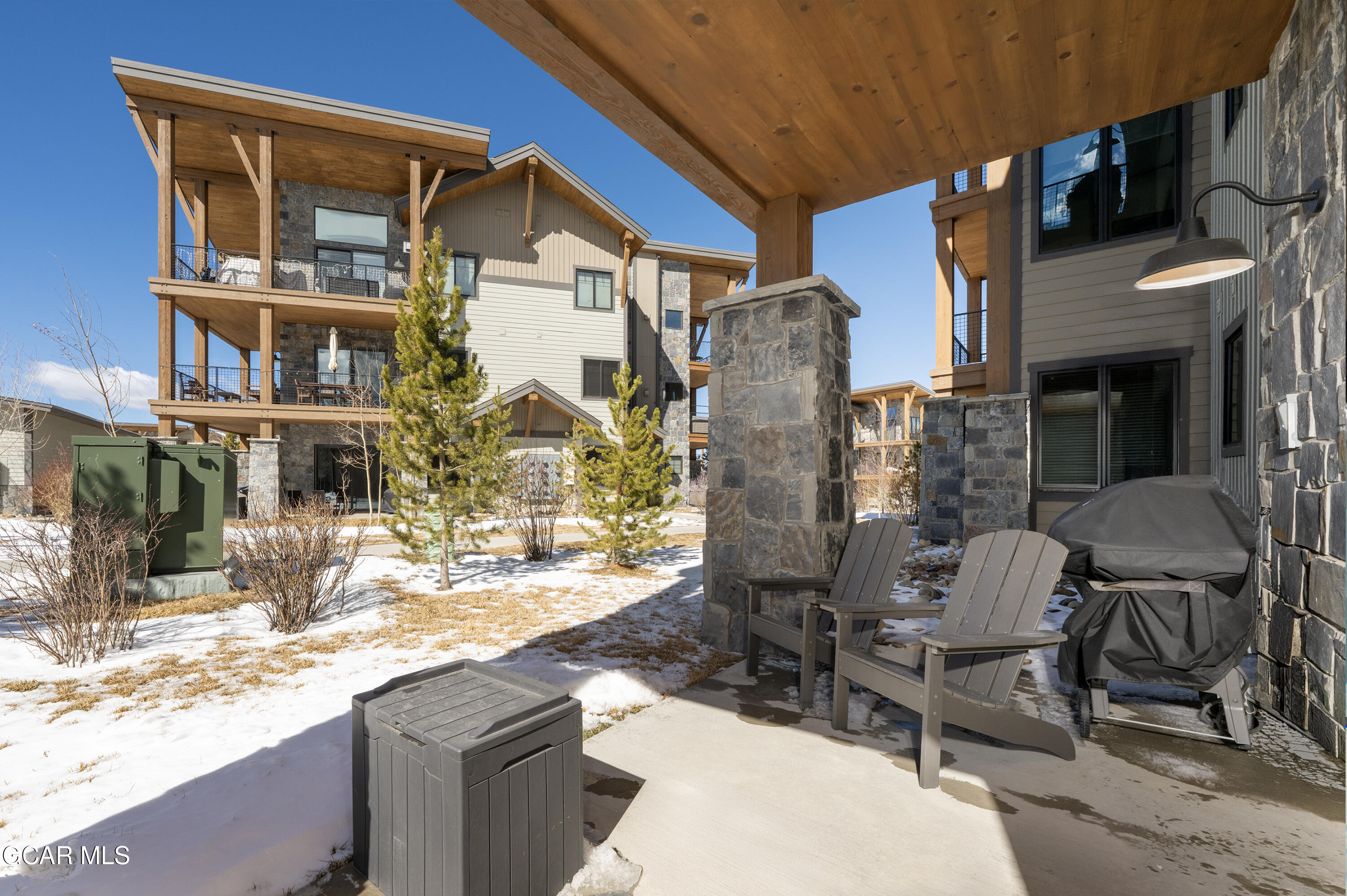 16 Springview Lane Fraser, CO 80442 - Photo 17 of 36 a view of a patio with a table and chairs and potted plants
