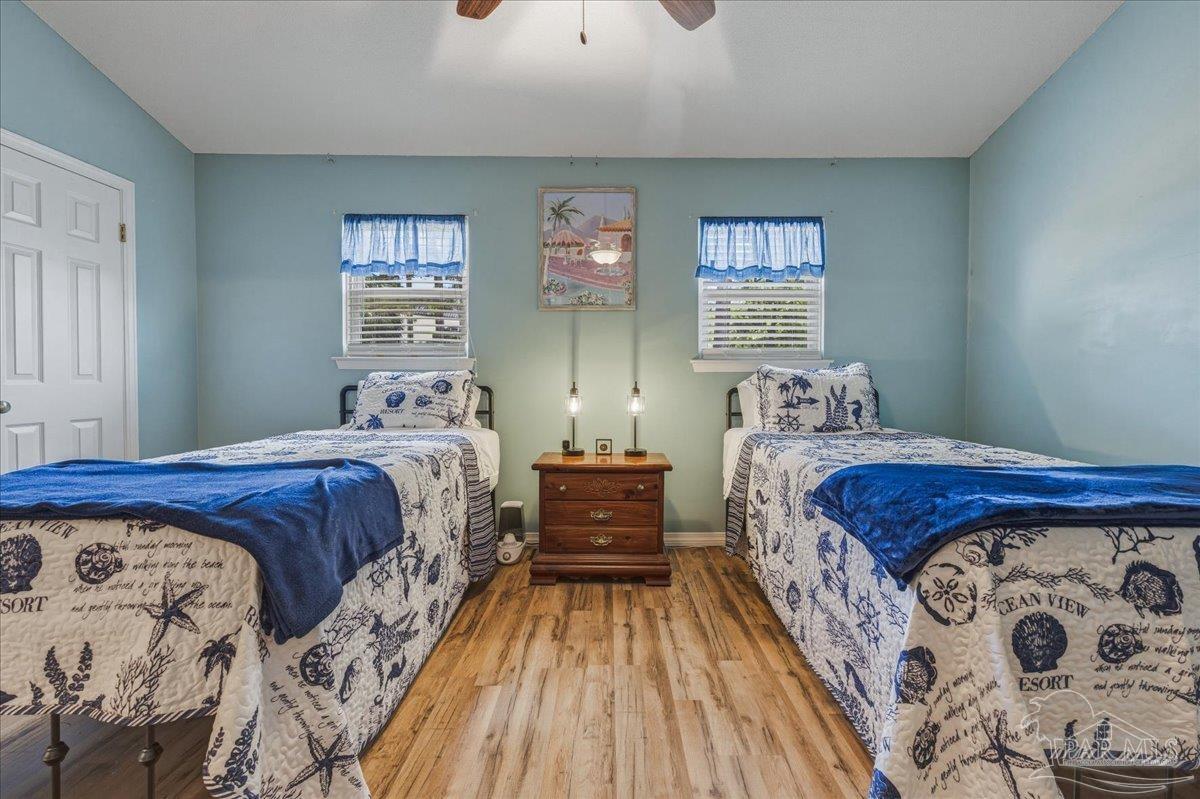 26063 Canal Road, Unit 3F Orange Beach, AL 36561 - Photo 57 of 72 a bedroom with a large bed and a window