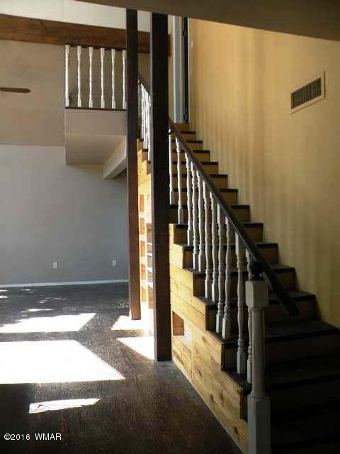 3062 Aspen Road Overgaard, AZ 85933 - Photo 36 of 47 a view of staircase with lots of frames on wall and a window
