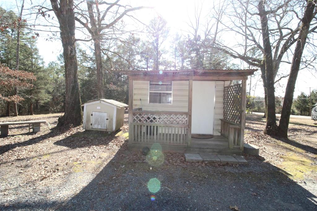 7105 Rodessa Ida Road Ida, LA 71044 - Photo 33 of 40 a view of a house with a yard covered in snow