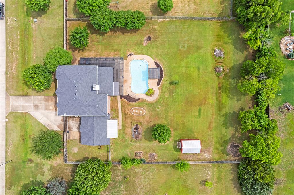 3931 Alpha Way Midlothian, TX 76065 - Photo 31 of 33 an aerial view of residential house with pool and yard