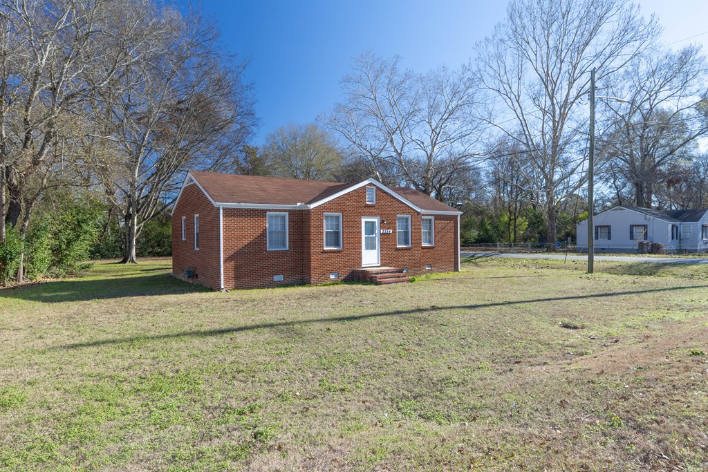 2254 South Lumpkin Road Columbus, GA 31903 - Photo 2 of 16 a front view of a house with a yard