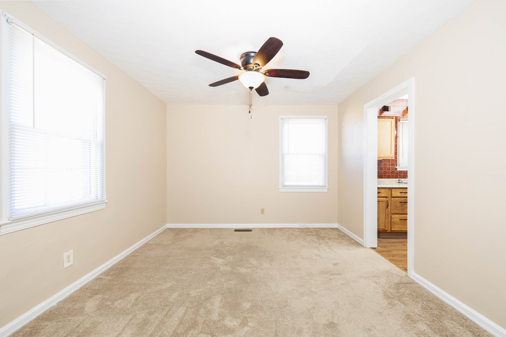 2254 South Lumpkin Road Columbus, GA 31903 - Photo 7 of 16 an empty room with windows and fan