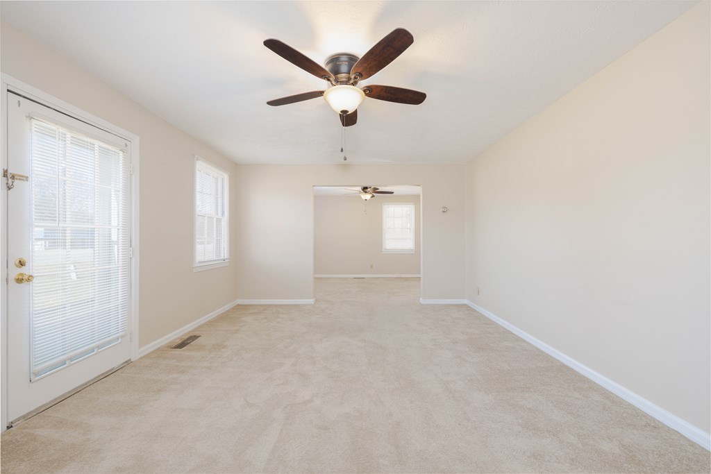 2254 South Lumpkin Road Columbus, GA 31903 - Photo 8 of 16 an empty room with ceiling fan and window