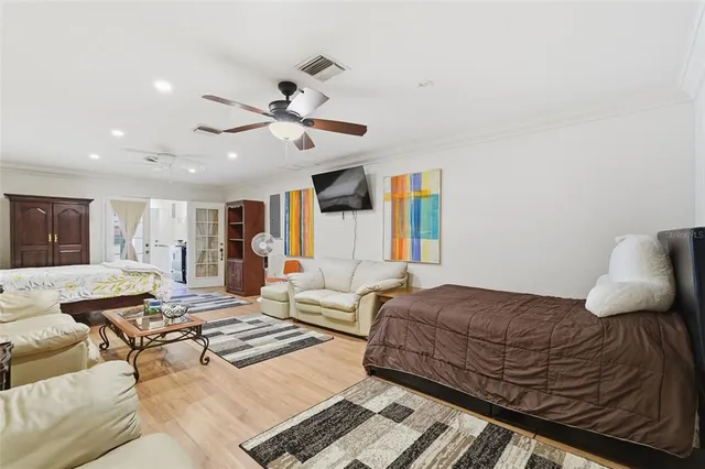 a bathroom with a granite countertop sink a mirror and shower