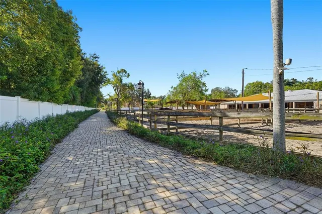 an aerial view of residential house with outdoor space and street view