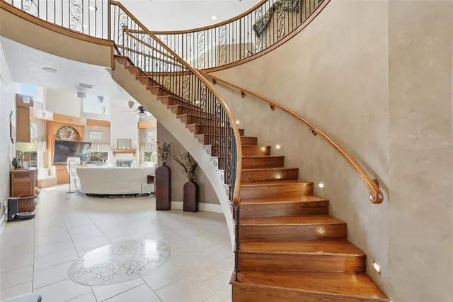 a front view of a house with swimming pool having outdoor seating