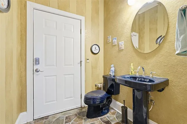 a picture of a bathroom with a sink