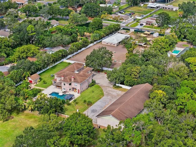 an aerial view of house with yard