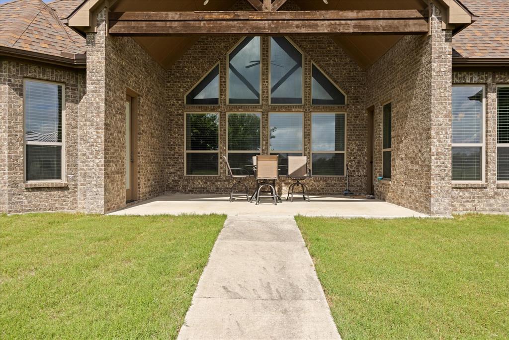 104 Rattling Antler Court Azle, TX 76020 - Photo 30 of 38 Covered patio has a gas line for outdoor kitchen.