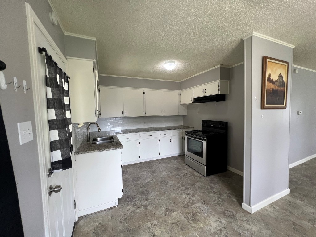 806 West 8th Street Taylor, TX 76574 - Photo 3 of 11 Cottage style kitchen with lots of storage. Tenant will need to bring their own refrigerator.