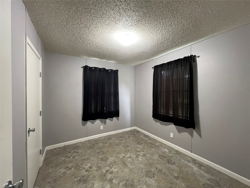 806 West 8th Street Taylor, TX 76574 - Photo 8 of 11 Each bedroom has it's own closet.